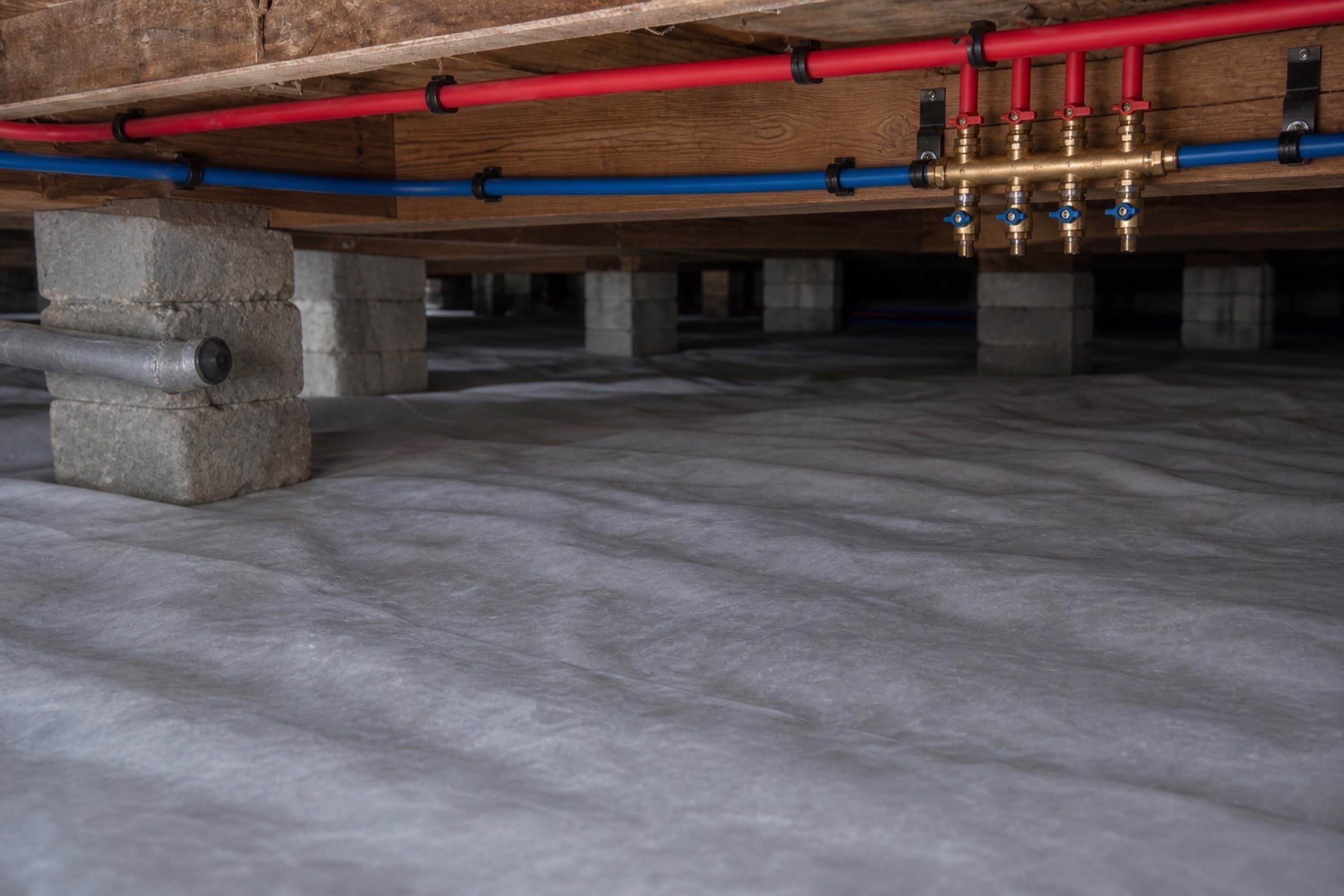 New PEX supply runs on proper supports with a labelled manifold and new shutoff valves